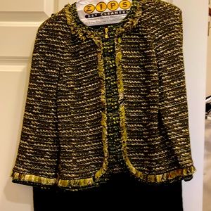 Two piece St. John knit skirt suit. Dry cleaned. Like new. Size 4